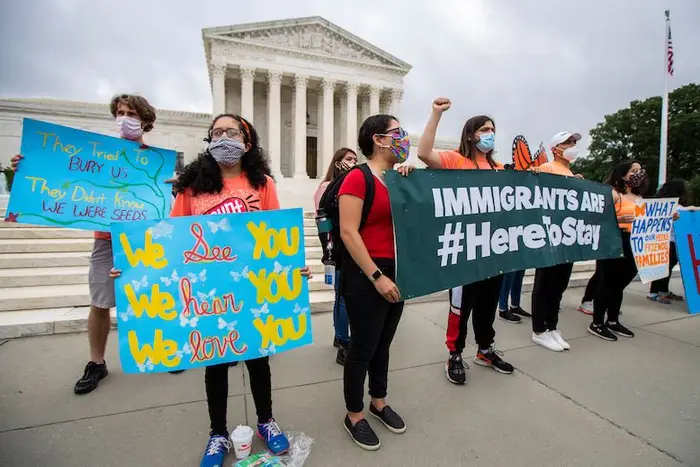 Deferred Action for Childhood Arrivals (DACA) students celebrate in front of the U.S. Supreme Court after the Supreme Court rejects President Donald Trump's bid to end legal protections for young immigrants, in Washington